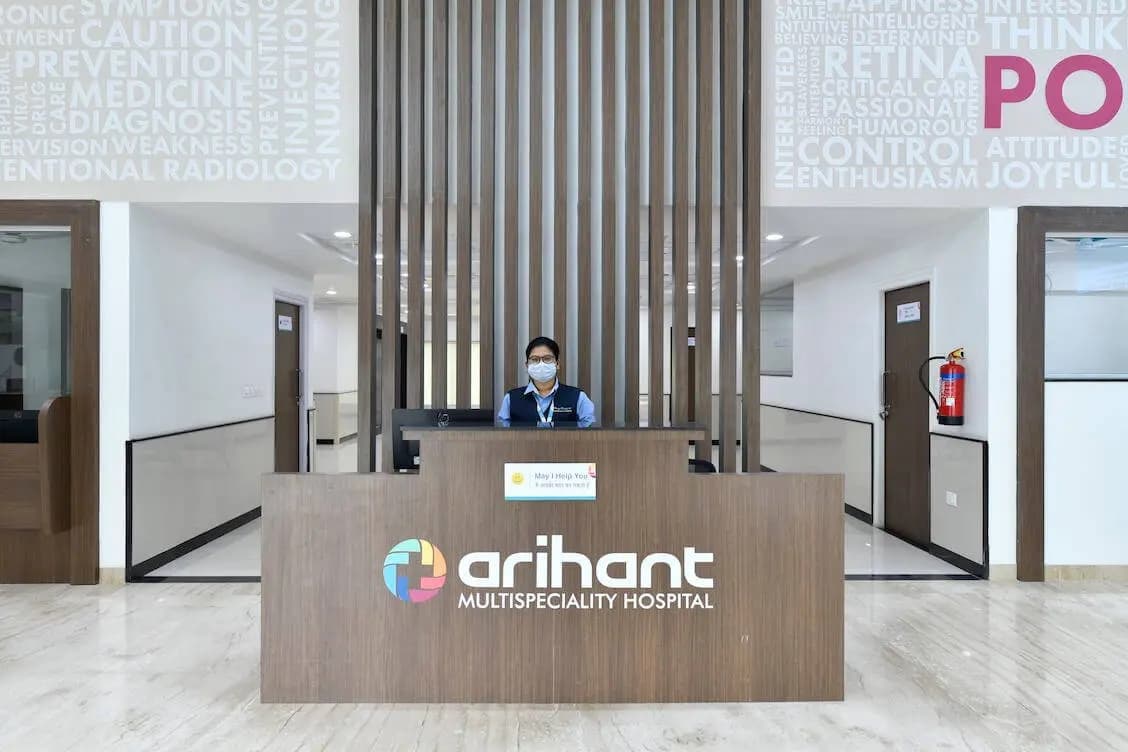 A staff member at the main reception desk